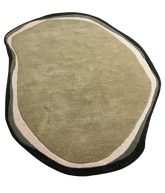 Organic shape hand-tufted iregular wool rug.
